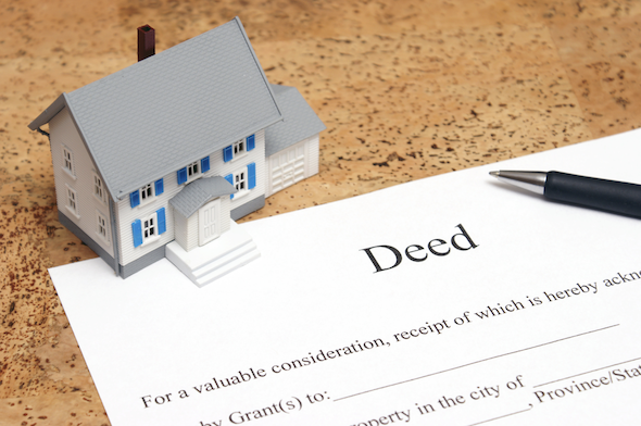 A metaphorical image of a deed to a house.